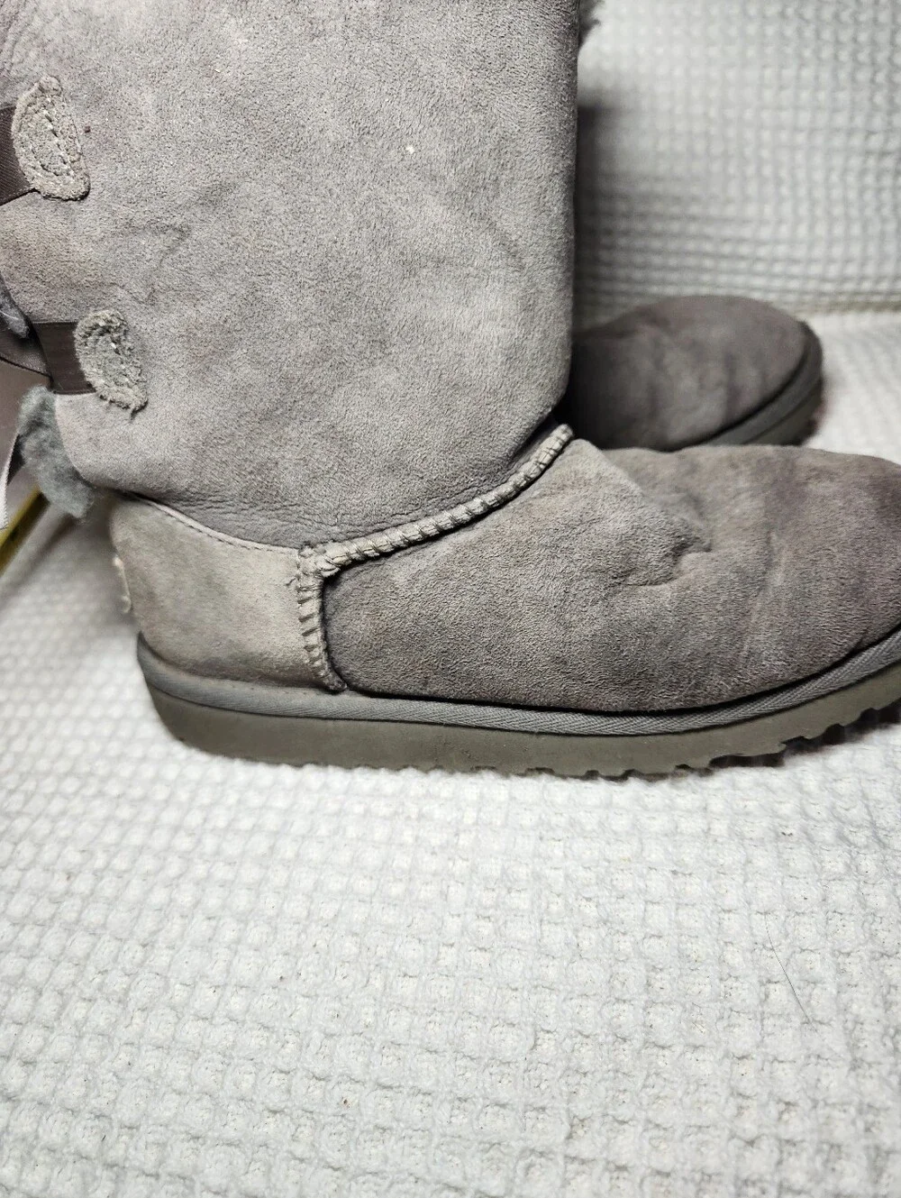 UGG Gray Bow Back Shearling Boots Flawed